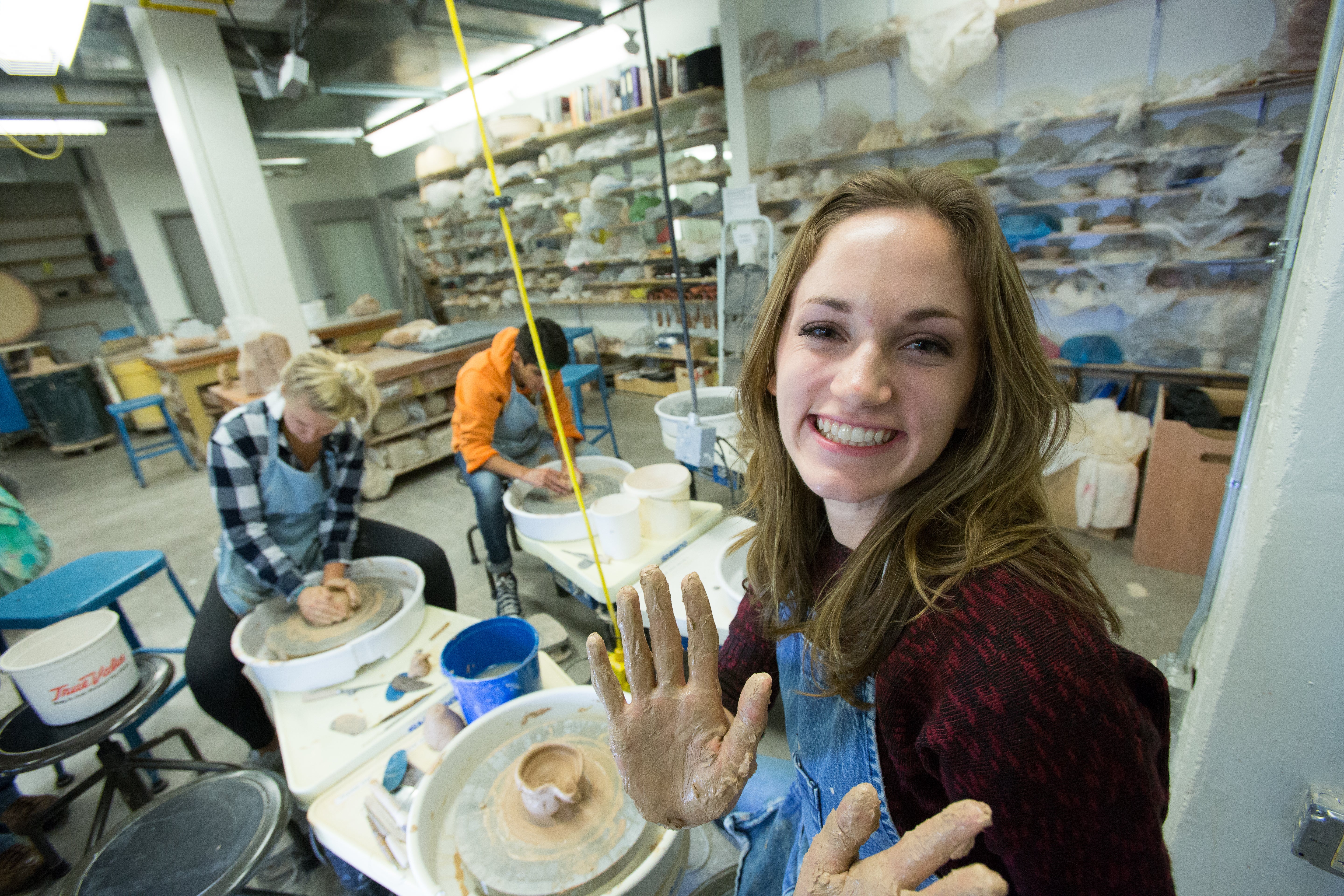 Person throwing on a ceramics wheel