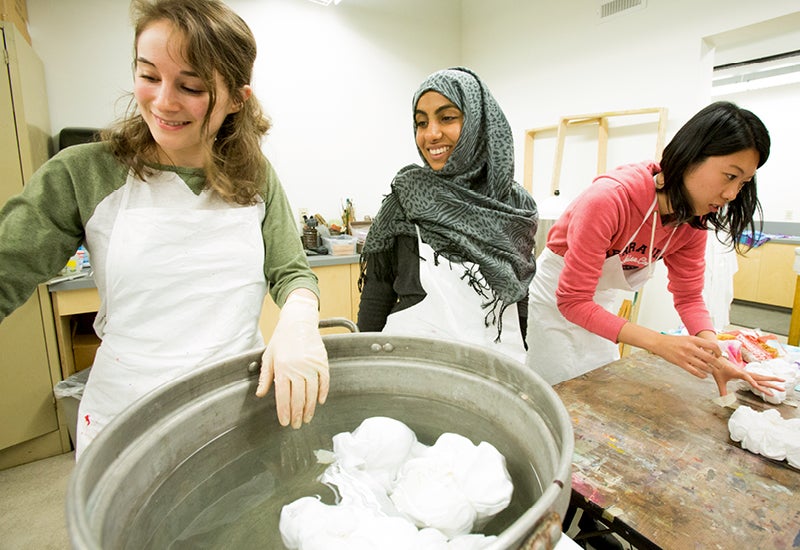 Craft Center Members dying cloth in a textile workshop.