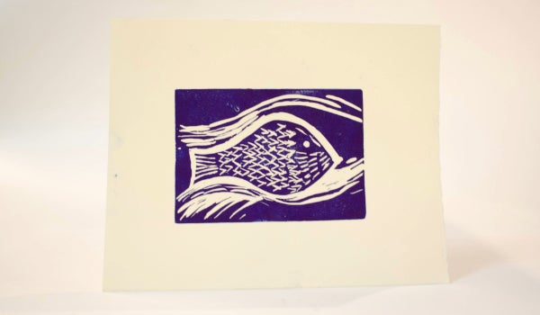 A print of a blue fish on display.