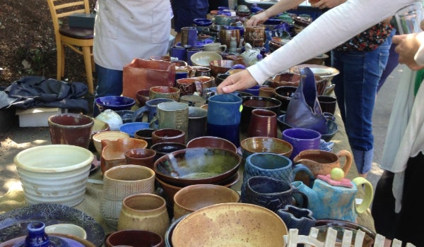A table full of pottery for sale at the Lonely Craft Sale.
